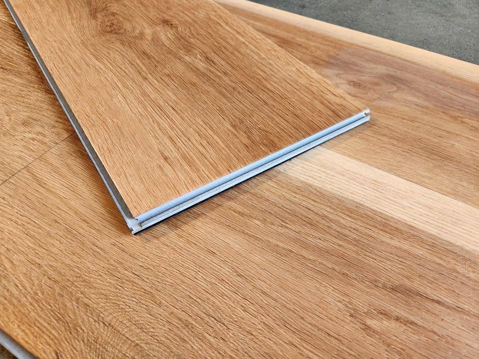 Monticello rigid core vinyl plank with attached pad